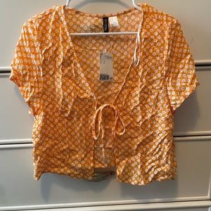 Orange flower crop top